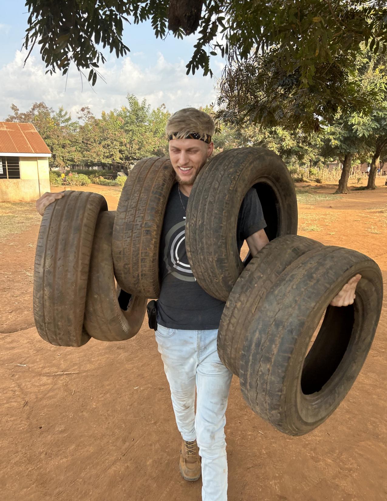 Seth helping build a playground in Uganda